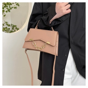 Fashionable pink crossbody bag with gold chain strap detail and matte PU leather finish