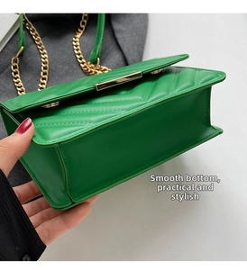 Detailed close-up of green PU leather shoulder bag with V-quilt pattern and gold chain