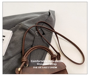Detail of adjustable leather strap and knotted handle on vintage brown crossbody bag