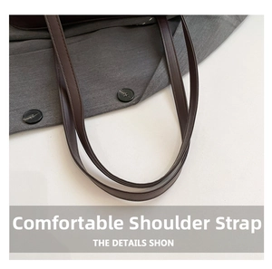 Detail of dark brown slim PU leather shoulder straps with neat stitching for handbags