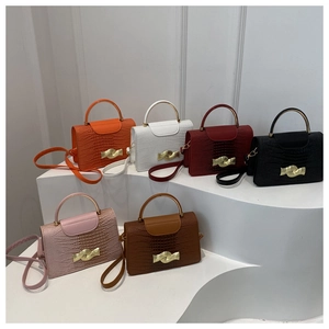 Detail view of mini square bags in six colors featuring faux crocodile embossed leather