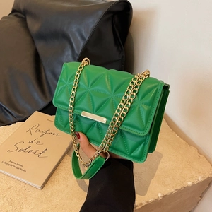 Chic green quilted shoulder bag with gold chain strap for spring 2025 fashion look
