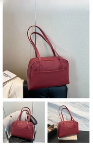 Detail view of the red PU leather tote bag with a smooth matte finish and front pocket