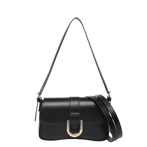 Classic black shoulder bag with gold horseshoe buckle and dual strap options