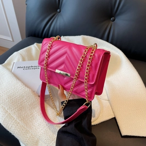 Hot pink quilted chain shoulder bag with gold hardware and V-pattern faux leather