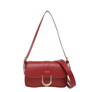Vintage dark red leather crossbody bag with iconic gold U-shaped buckle and dual straps