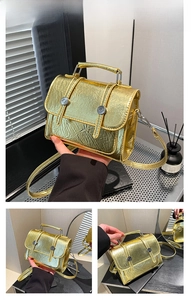 Macro detail of golden metallic bag with wrinkled texture and chain strap
