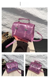 Detail view of pink metallic mini crossbody bag with unique crinkled texture and silver buttons