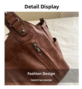 Close-up of brown leather tote side pocket with metal rivets and lychee texture
