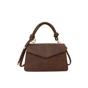 Retro dark brown frosted leather crossbody bag with top handle and gold hardware detail