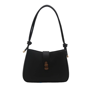 Minimalist black matte PU leather shoulder bag with vintage bronze metal buckle on white background