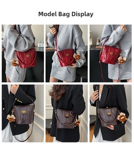 Detail view of quilted bucket bag in wine red and coffee brown with metal clasp