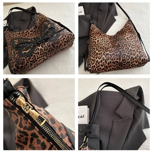 Detailed views of leopard print tote bag with black bow and gold zipper hardware