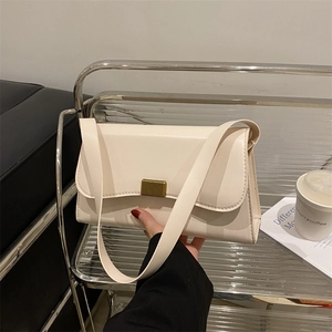 Minimalist beige rectangular underarm bag with vintage gold metal buckle and wide strap