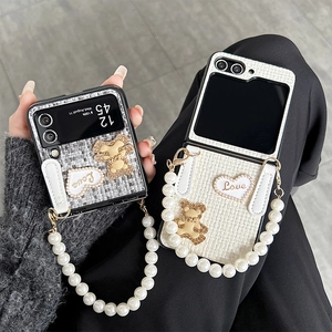 Chic Samsung Galaxy Z Flip case with pearl handle, heart charm and bear pendant