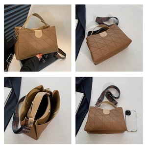 Detail view of brown quilted PU tote with bohemian wide strap and inner pouch