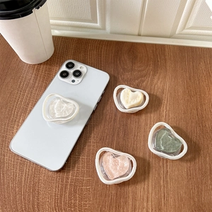 Support rétractable pour téléphone en forme de cœur avec texture marbre sur bois