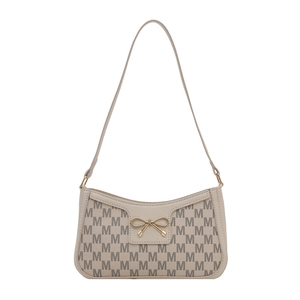 Chic beige crescent armpit bag with monogram M pattern and gold bow charm detail