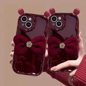 Wine red iPhone case with velvet bow and golden rose in high-gloss wavy silicone