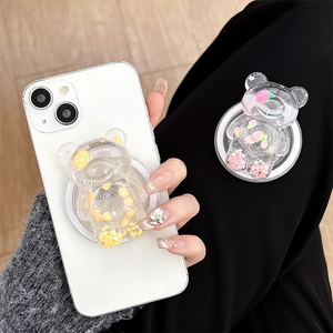 Supporto per telefono a forma di orsetto con glitter e frutta su smartphone bianco