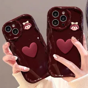 Red bow phone case with 3D hearts for iPhone 16/17 Pro featuring a wavy edge design