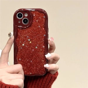 Glittery red iPhone case with star sequins and a wavy frame held by a hand