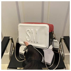 Detail of tricolor crossbody bag with 3D SM letters and wide striped shoulder strap