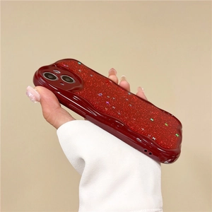 Detail view of wavy edge wine red iPhone case with glitter and colorful star sequins
