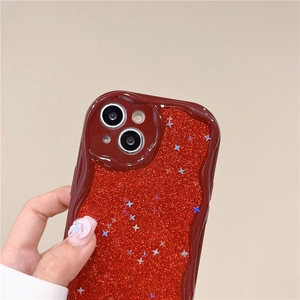 Detail of red glitter iPhone case with wave edges and sparkling star patterns