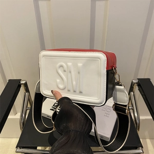Three-color crossbody camera bag with 3D SM letter relief and wide fabric shoulder strap