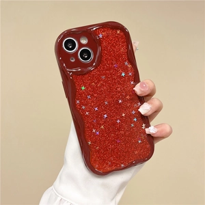 Close-up of wavy wine red iPhone case with glitter and laser star sequins held by hand