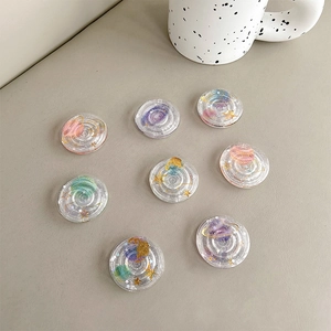 Clear round planetary phone grip set with glitter sequins and cosmic galaxy theme patterns