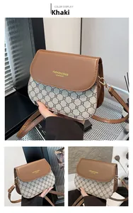 Détails du sac selle vintage en cuir kaki avec imprimé jacquard et lettrage doré chic