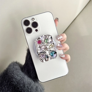 Magnetic silver lava texture phone grip with colorful gemstones on white smartphone