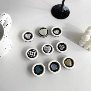 Round heart phone grip sockets with checkered and marble patterns for desk stand support