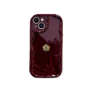 Wine red wavy iPhone case with gold camellia rose accent and shockproof protective edge