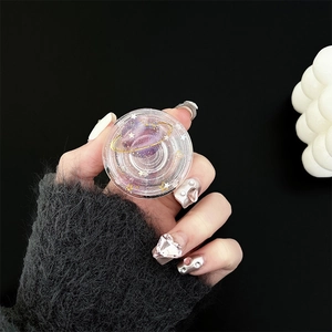 Detail of transparent planet phone socket with purple galaxy design and gold ring motif
