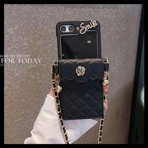 Quilted black leather phone wallet case with gold rose emblem and crossbody chain
