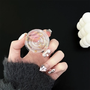 Close-up of clear celestial resin phone socket with silver glitter and gold star moon patterns