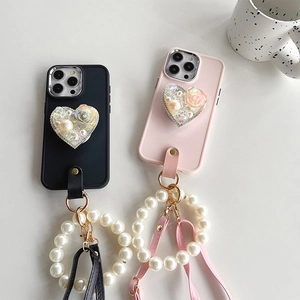Luxe iPhone case with rhinestone heart stand, pearl strap and floral accents
