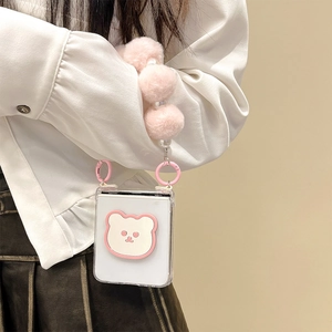 Transparent flip phone case with cute plush bear, pink fur balls and pearl hand strap