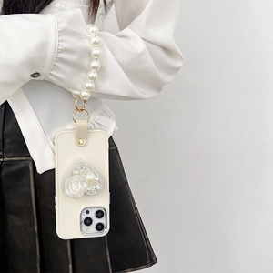 Cream iPhone case with pearl wrist strap and heart rhinestone flower decoration