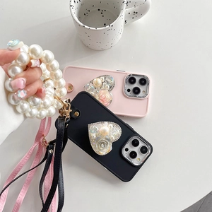 Pink and black iPhone cases with heart-shaped rhinestone stand and pearl handle strap