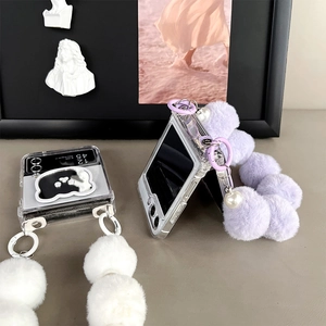 Close-up of clear Z Flip 6 cases with plush bear mirrors and pearl wrist straps