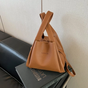 Chic caramel brown lychee leather bucket bag with unique geometric folding design