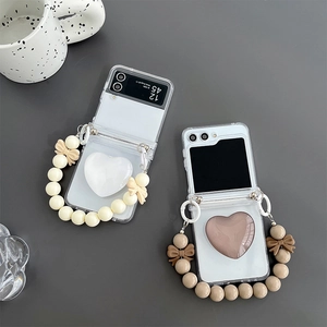 Z Flip foldable phone case with heart grip and bead bow bracelet in cream and coffee tones
