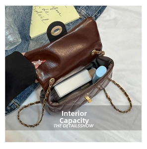 Detailed interior view of a brown quilted crossbody bag showing its storage capacity