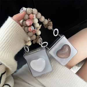 Samsung Z Flip 6 case with 3D heart grip, pearl bead chain and bow strap accessory