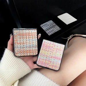Close-up of woven texture phone case for Samsung Z Flip with vibrant orange and blue patterns