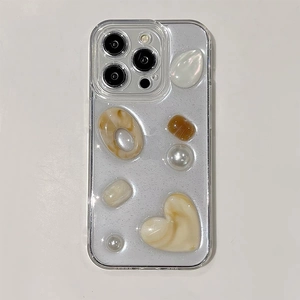 Macro detail of iPhone case with glitter finish and marble resin 3D stone ornaments
